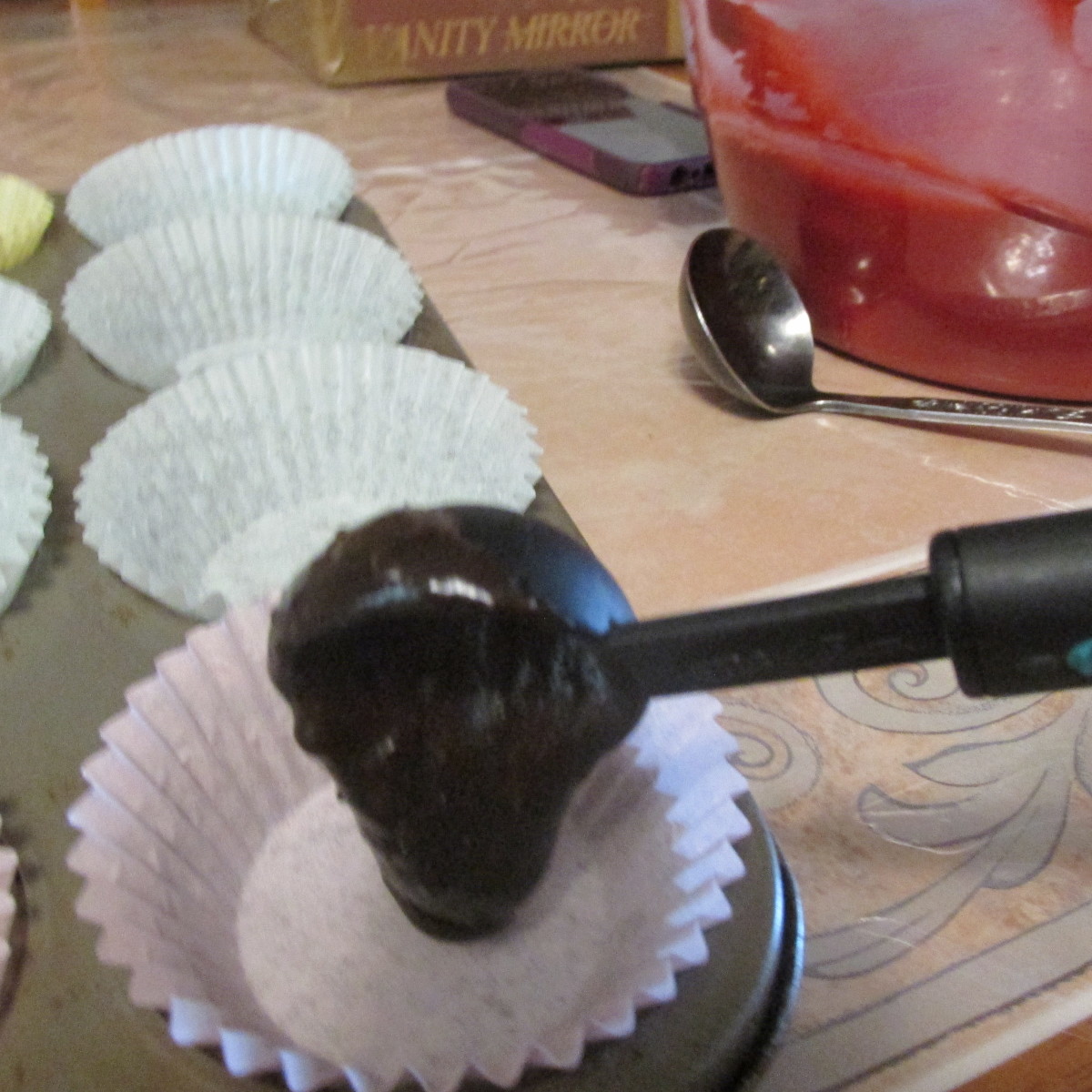 Drop the brownie batter into the bottom of each cupcake liner.