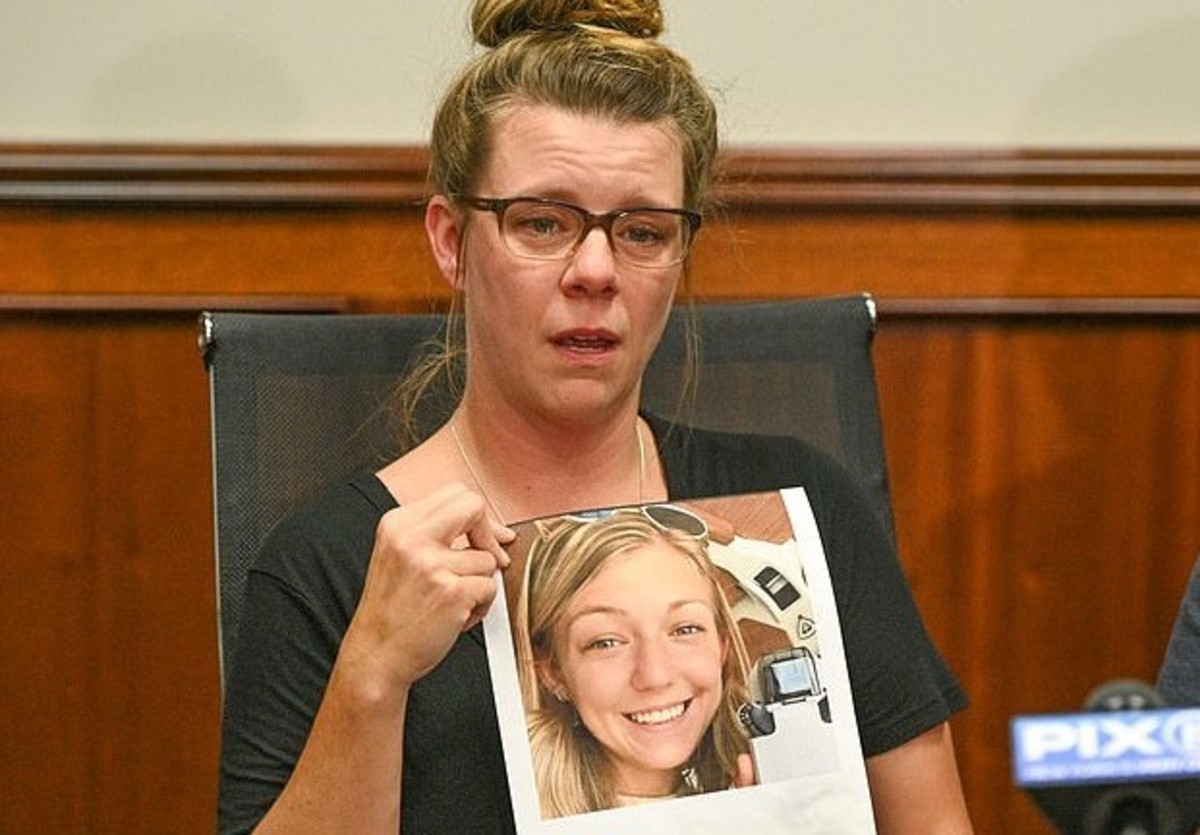 Nicole Schmidt talks to the media with a picture of her missing daughter, Gabby Petito. Photo courtesy of David Wexler for DailyMail.com.