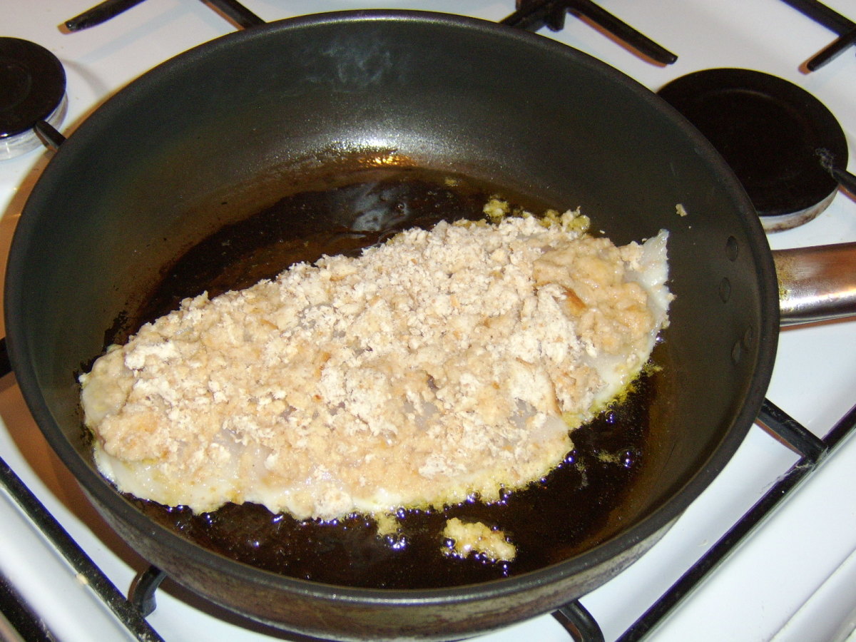 Shallow fry the breaded whiting in oil