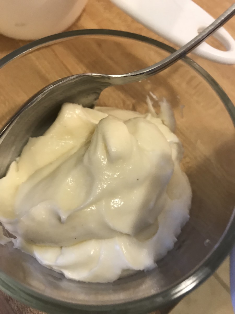 Add a tablespoon of milk to the reserved cream cheese mixture and stir until smooth.