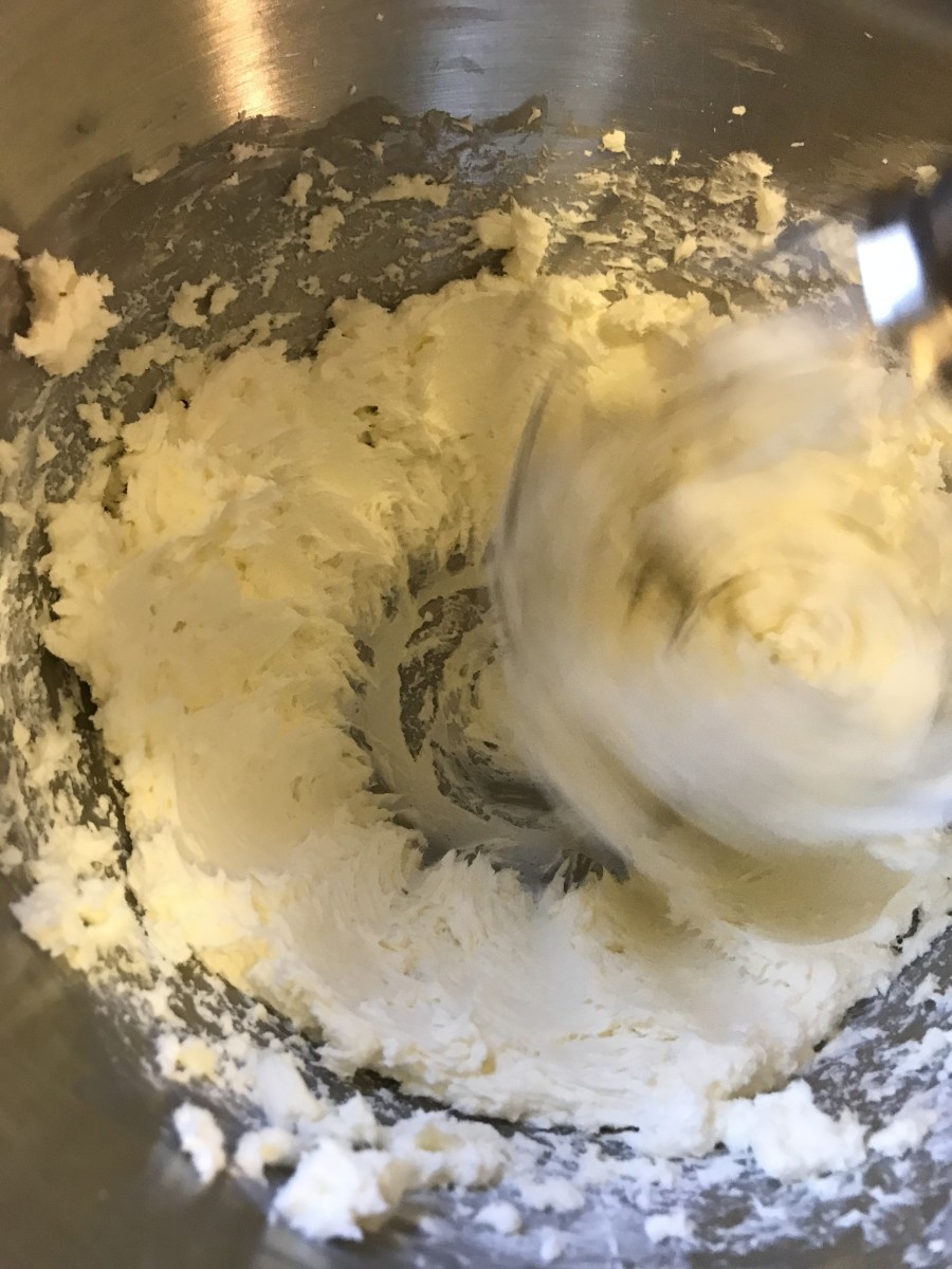Beat cream cheese until light and fluffy. Add sugar and flour and beat until smooth. Reserve 1/2 cup of this mixture before adding the remaining ingredients.
