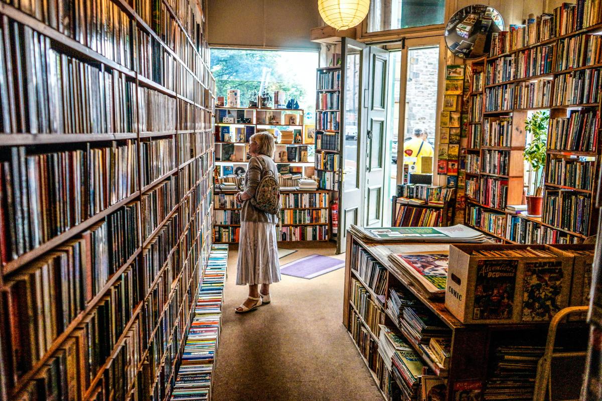 A woman browsing in a bookstore