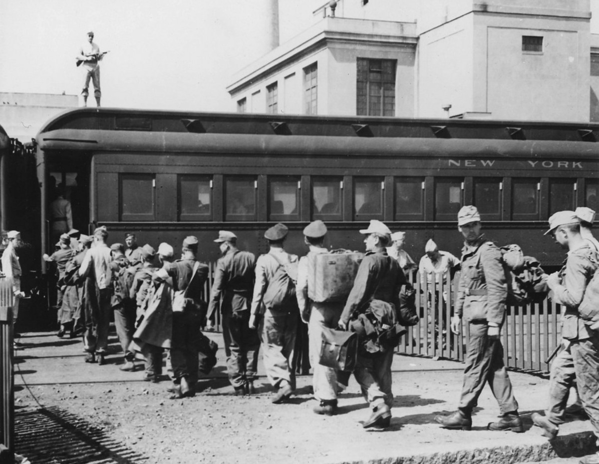 German POWs board a train in Boston on the way to their camp, 1943