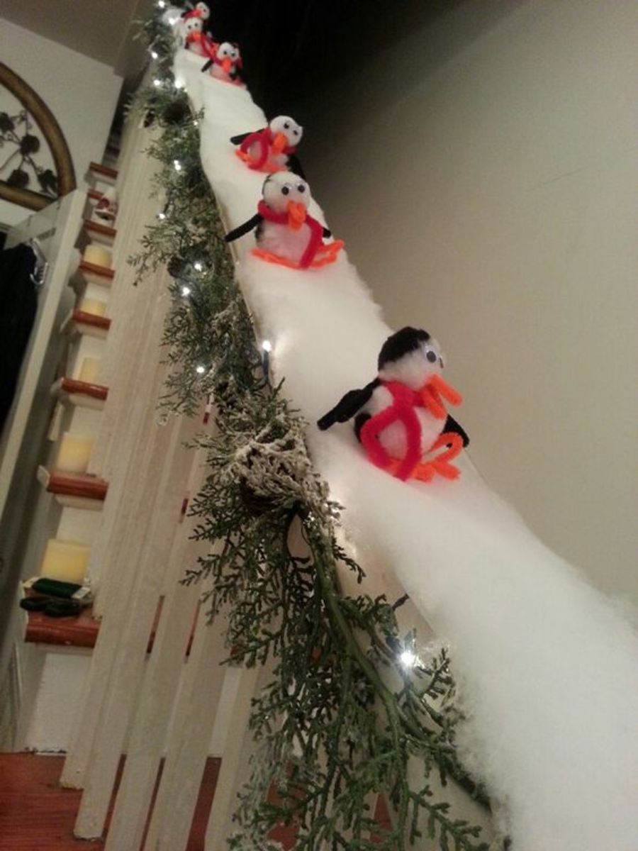 These little penguins sliding down the bannister are precious!