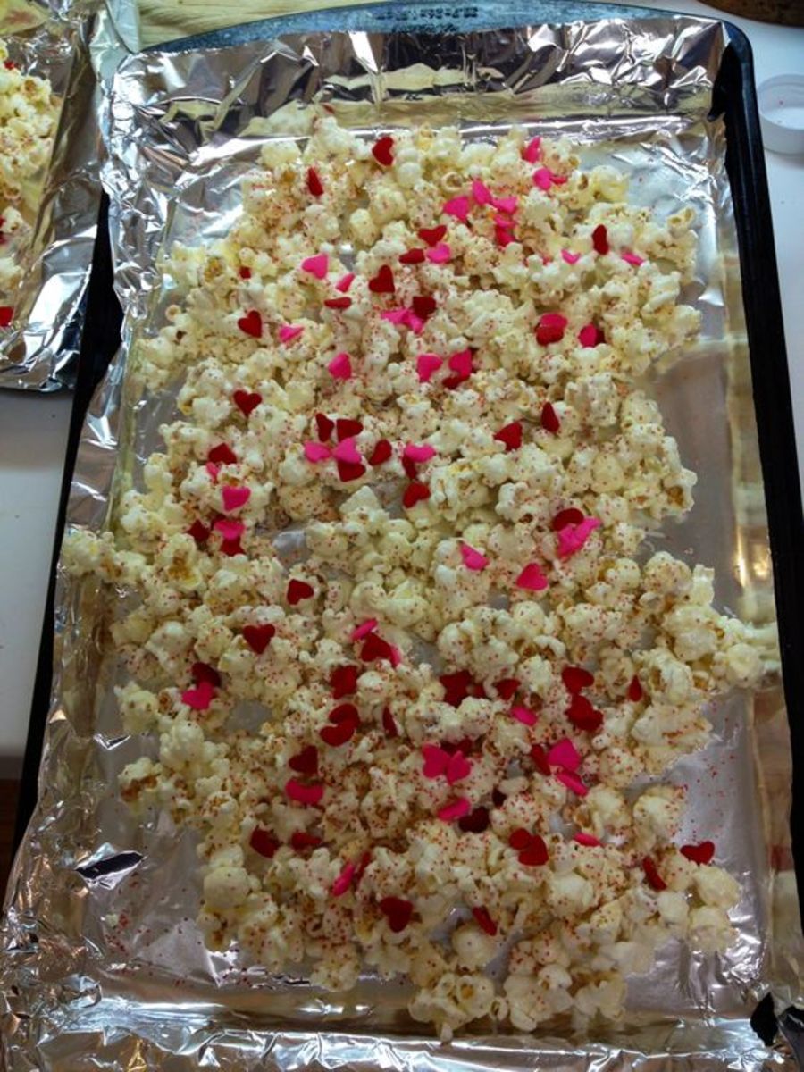 White candy melts, air popped popcorn & sprinkles. Inexpensive valentine treat for the kid's class.