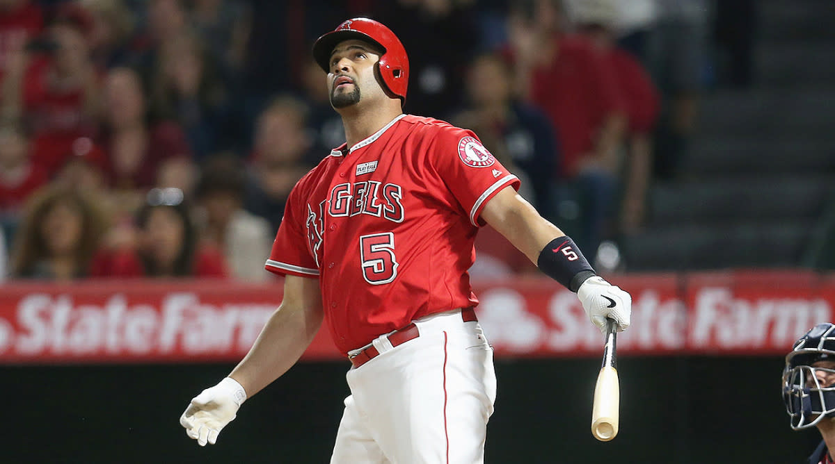 Albert Pujols watches one of his many homers