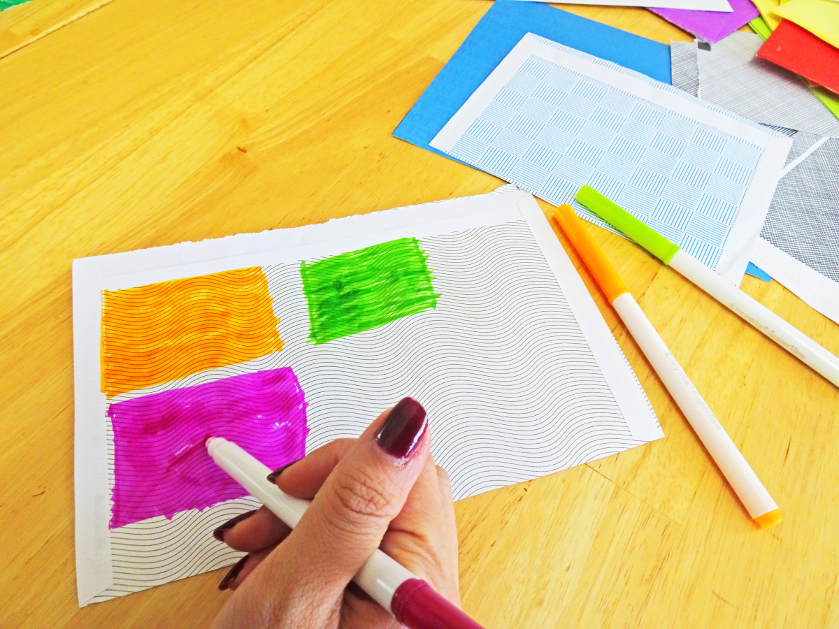 Use markers to make colorful rectangles on the patterned envelope paper.