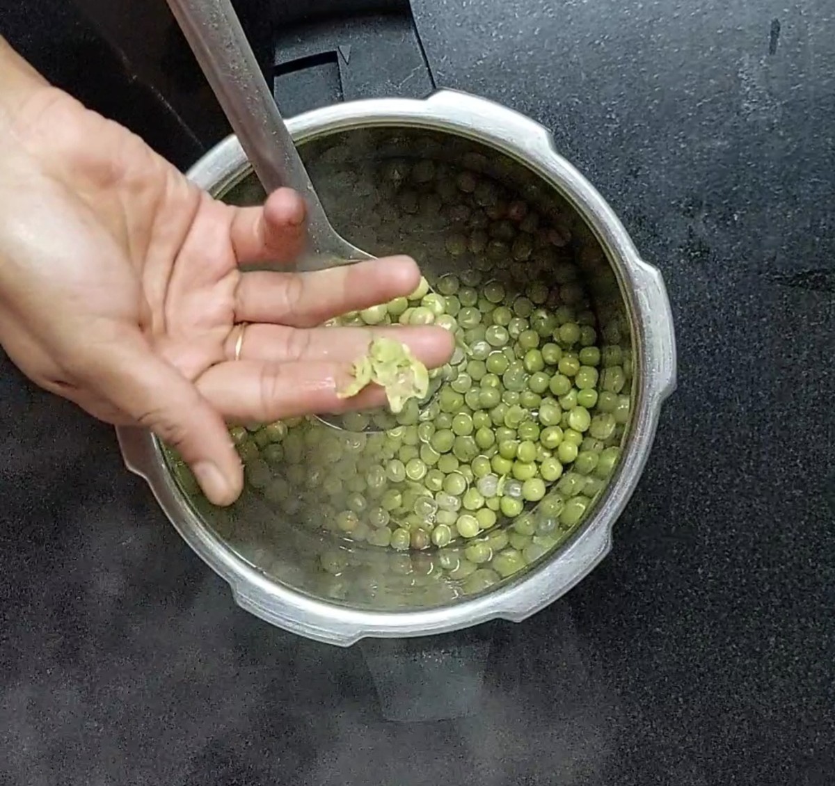 Once the pressure of the cooker releases, open the lid, check to see if peas are cooked completely. Set aside.