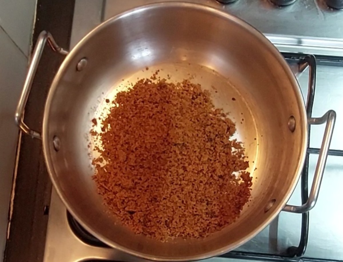 In a pan, add 1/2 cup of jaggery (powdered or crumbled).
