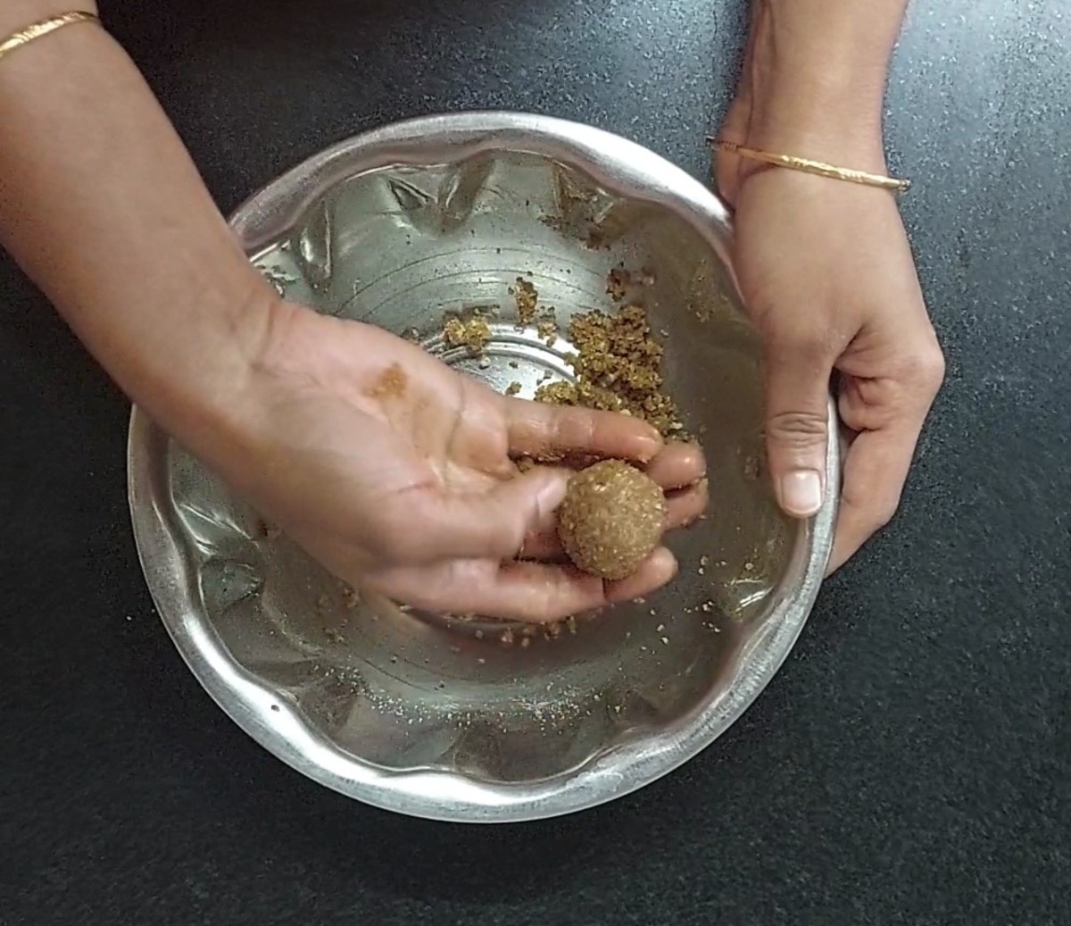 Transfer to a plate. Prepare the remaining laddus using the mixture.