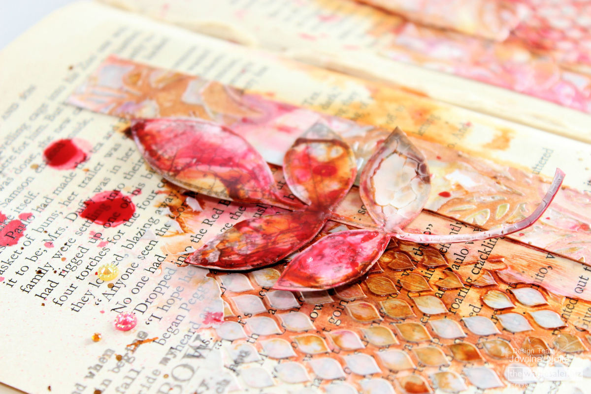 Stencils can be used to create amazing backgrounds on altered book pages