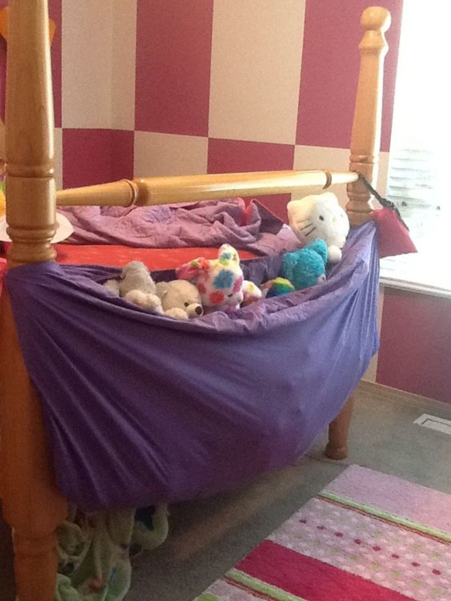 Repurpose a fitted sheet into a stuffed animal hammock.