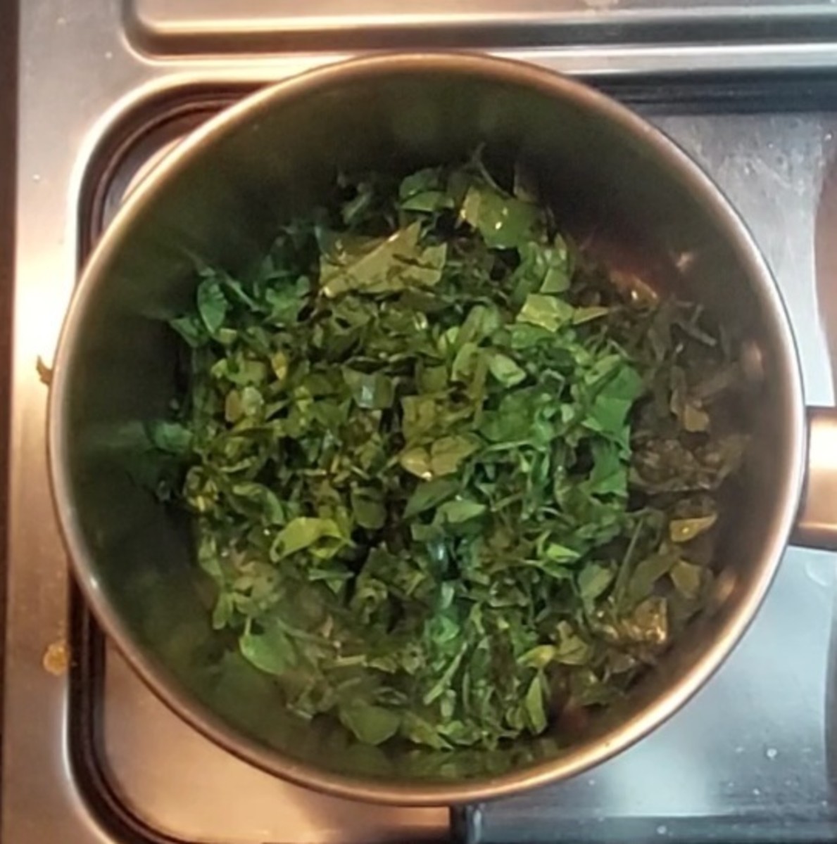 In a pan heat 1 teaspoon oil, add 1 cup claened and chopped fresh methi or fenugreek leaves.