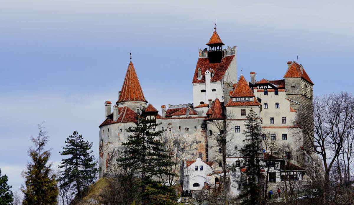 The Bran Castle is located on a steep hill in Transylvania, a region in Romania.