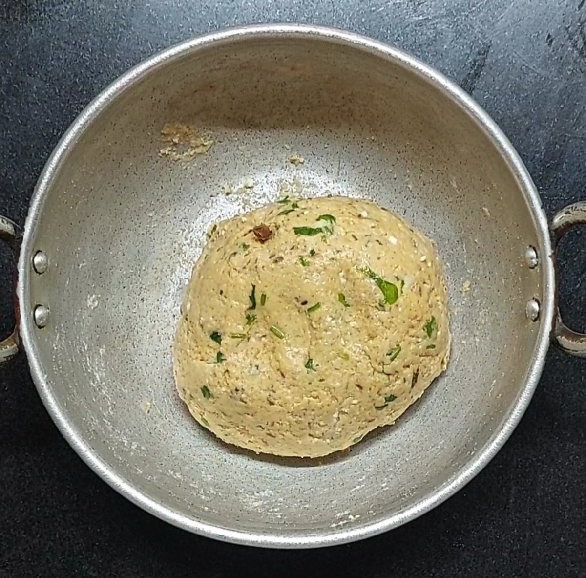 Gradually add water to avoid making a sticky dough.  Grease the dough with 1 teaspoon oil, cover and let sit for 10 minutes.