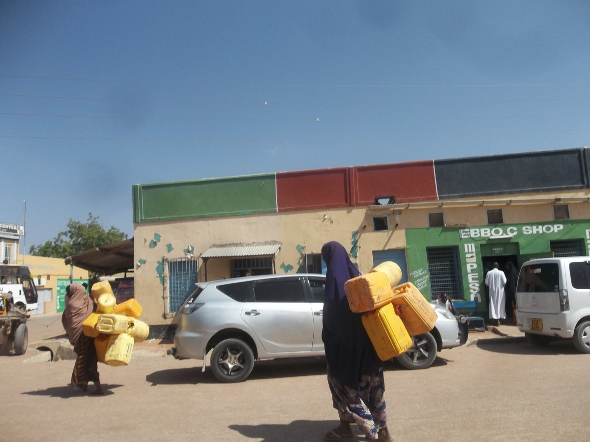 A section of Wajir Town. Note the women with plastic water containers