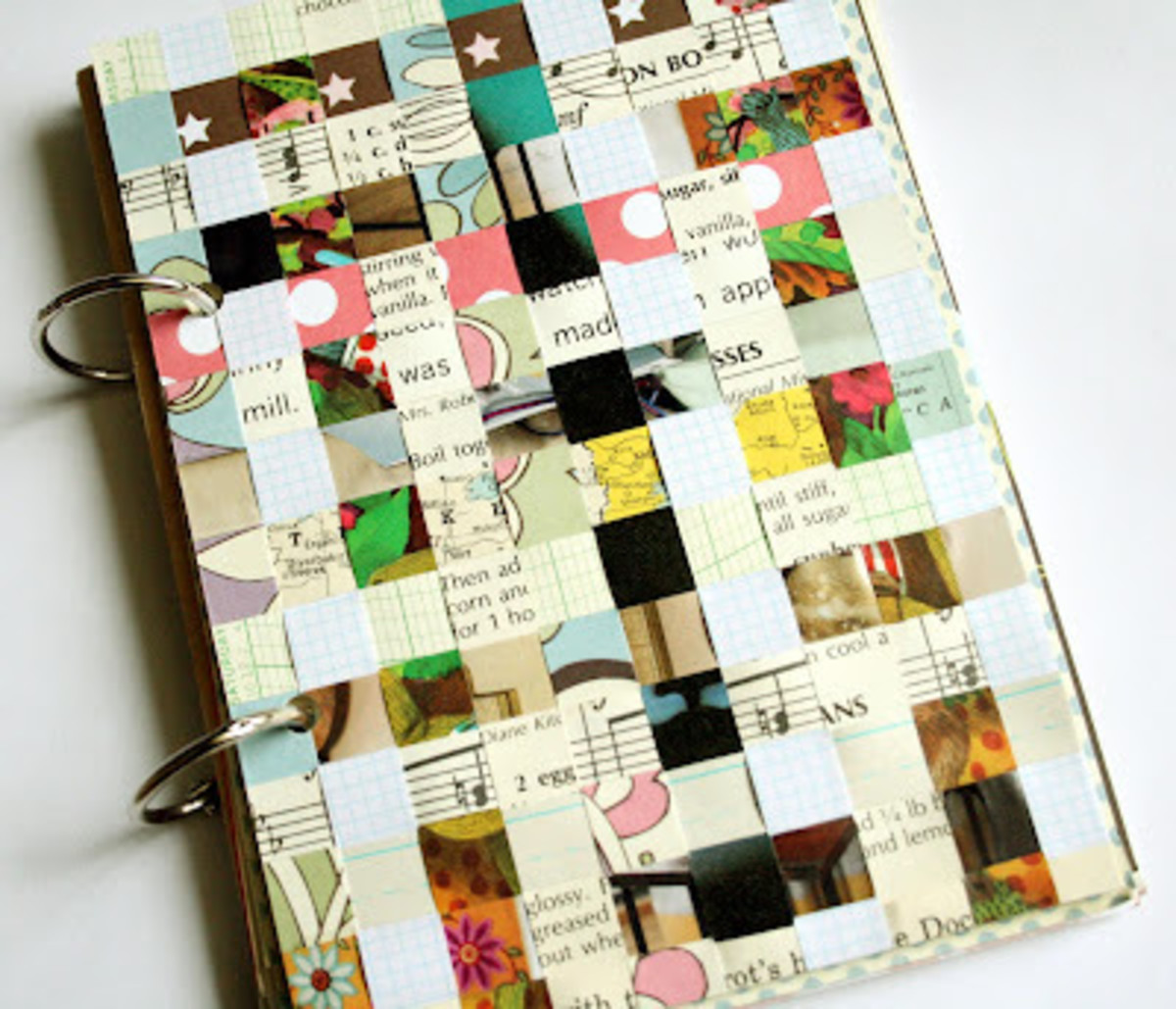 A truly custom journal cover made of cardboard and paper scraps. Great recycle project. I would add a nameplate to this cover.
