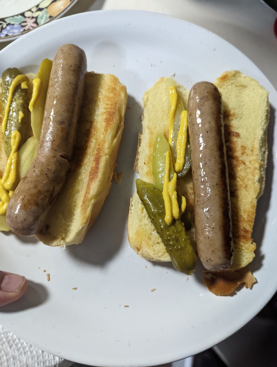 Brats and Buns Sauteed in a Frying Pan