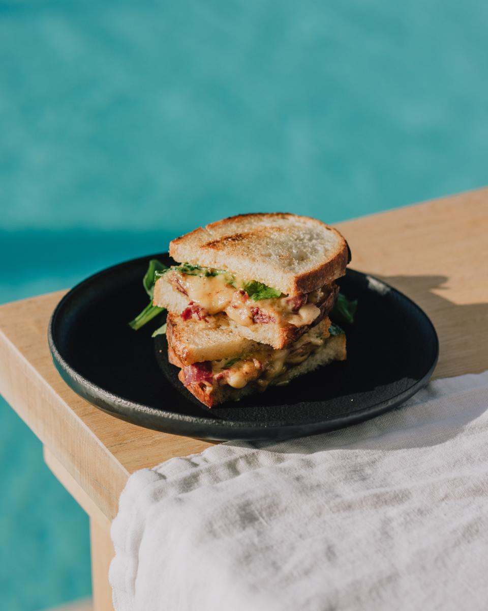 Photo by Ata Ebem: https://www.pexels.com/photo/grilled-sandwich-stack-on-table-by-pool-10831659/