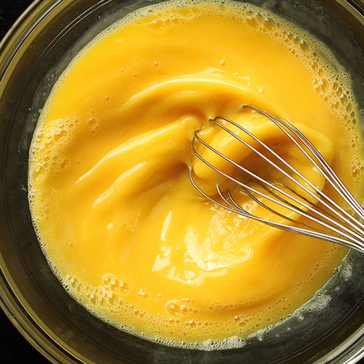With an electric mixer, handheld mixer, or blender, beat egg yolks until thick and pale yellow.
