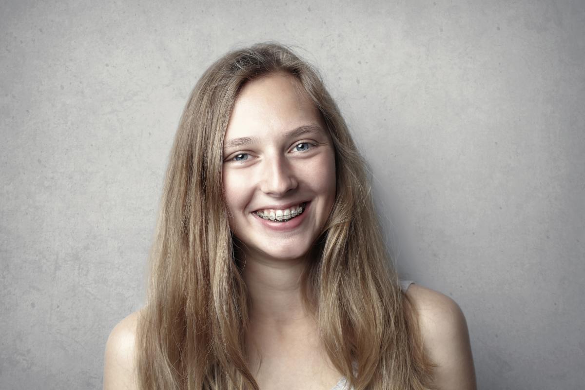 A girl wearing clear braces