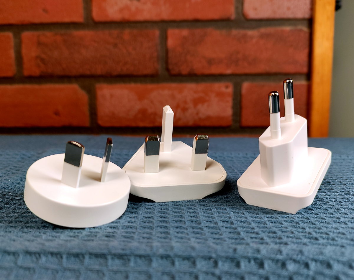 A set of three travel adapters