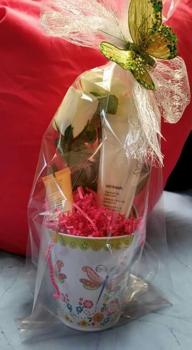 Mother's Day gift basket - Satin Hands hand cream with mini hand cream & manicure set. Roses, butterfly clip, tin and manicure set from the dollar store. 