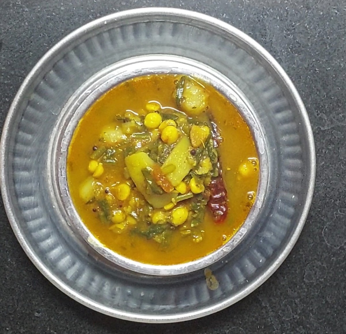 Easy and tasty bottle gourd-spinach dal is ready to sreve. Serve hot with rice, chapati or roti and enjoy.