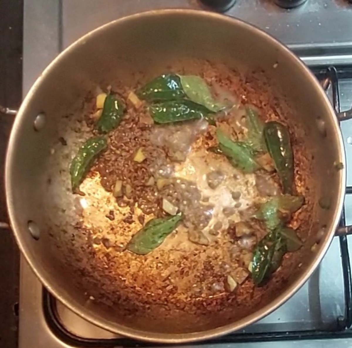 In a same pan, heat 1 teaspoon ghee and 1 teaspoon oil, splutter 1 teaspoon cumin seeds, add a spring of curry leaves, 1 teaspoon chopped ginger, saute for some seconds.