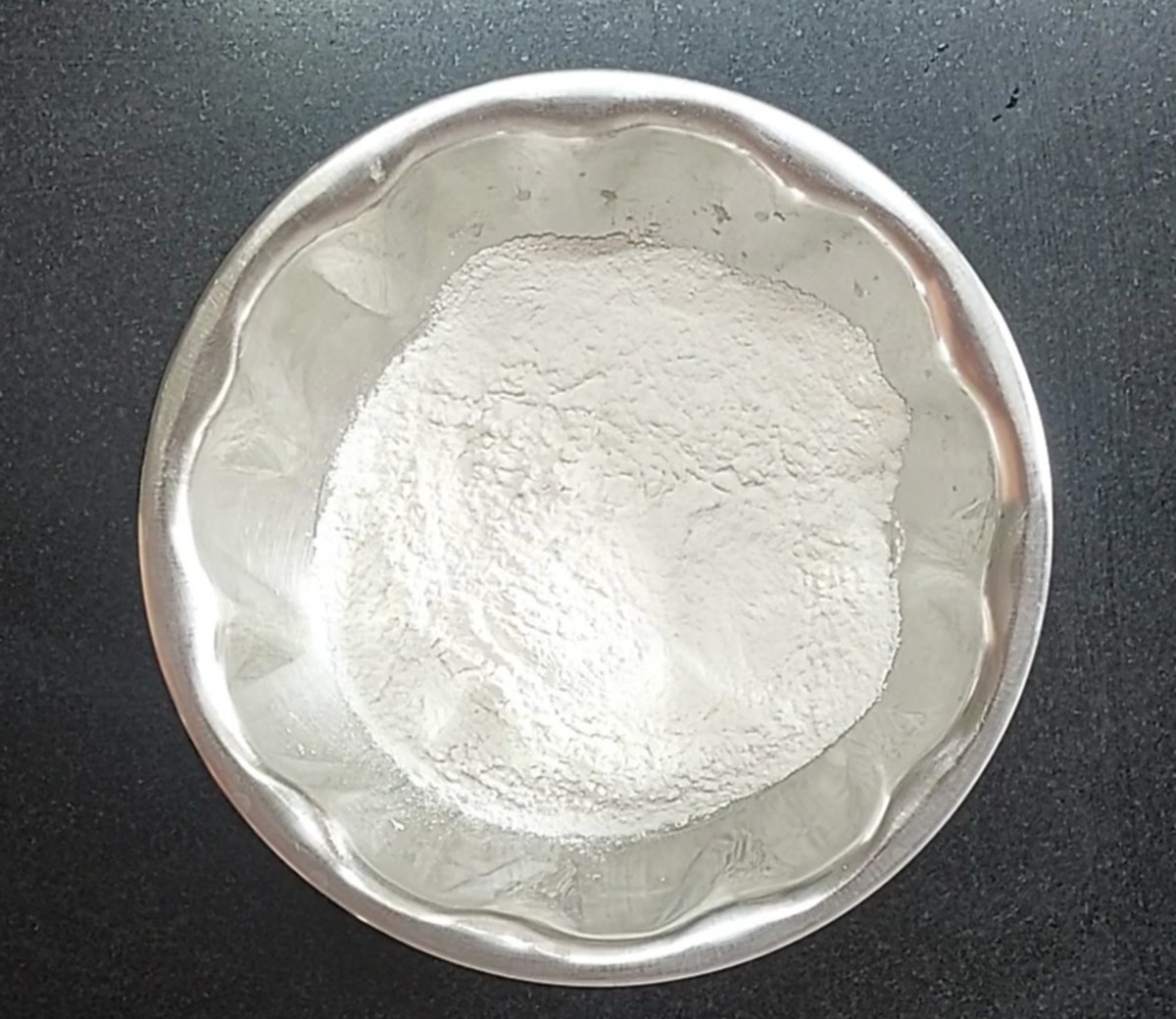In a wide vessel, take 1 cup of rice flour.
