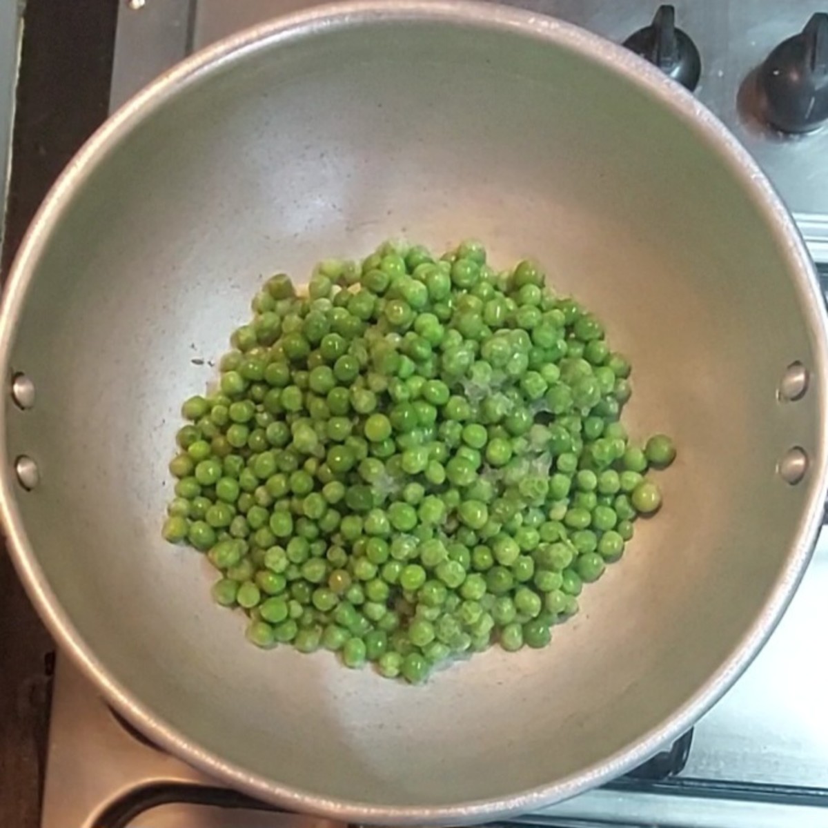 Add 2 cups frozen peas, salt to taste.