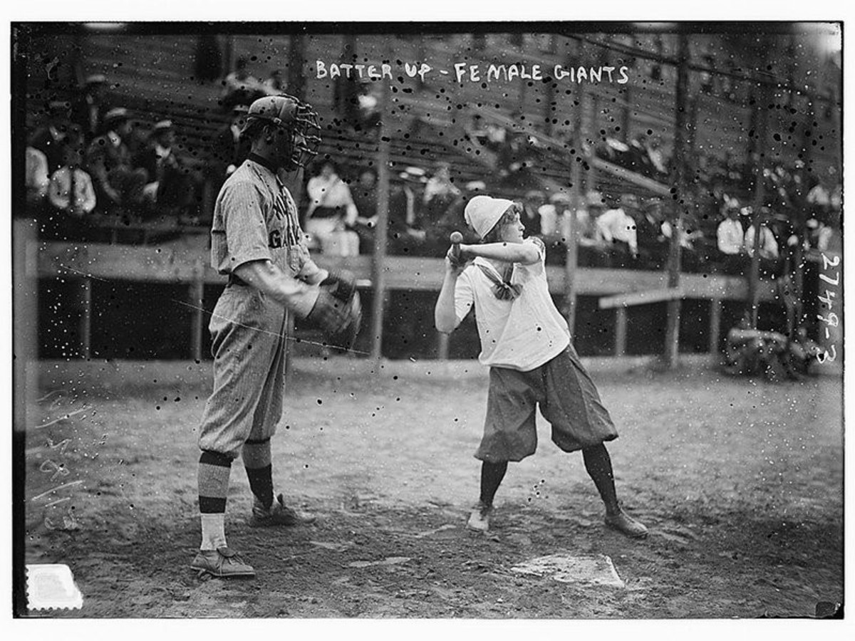 Ida Schnall, Captain of the Female Giants at bat, John Tortes Meyers of the Major League NY Giants catching. 