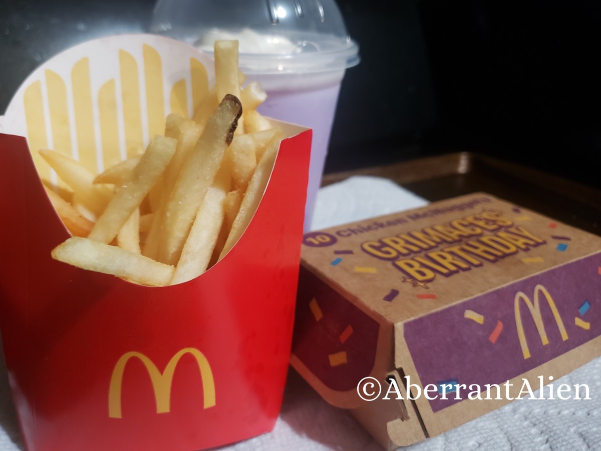 https://images.saymedia-content.com/.image/t_share/MTk4ODA1MDE4MzExMjA2NjYz/mcdonalds-grimace-birthday-meal-review.jpg