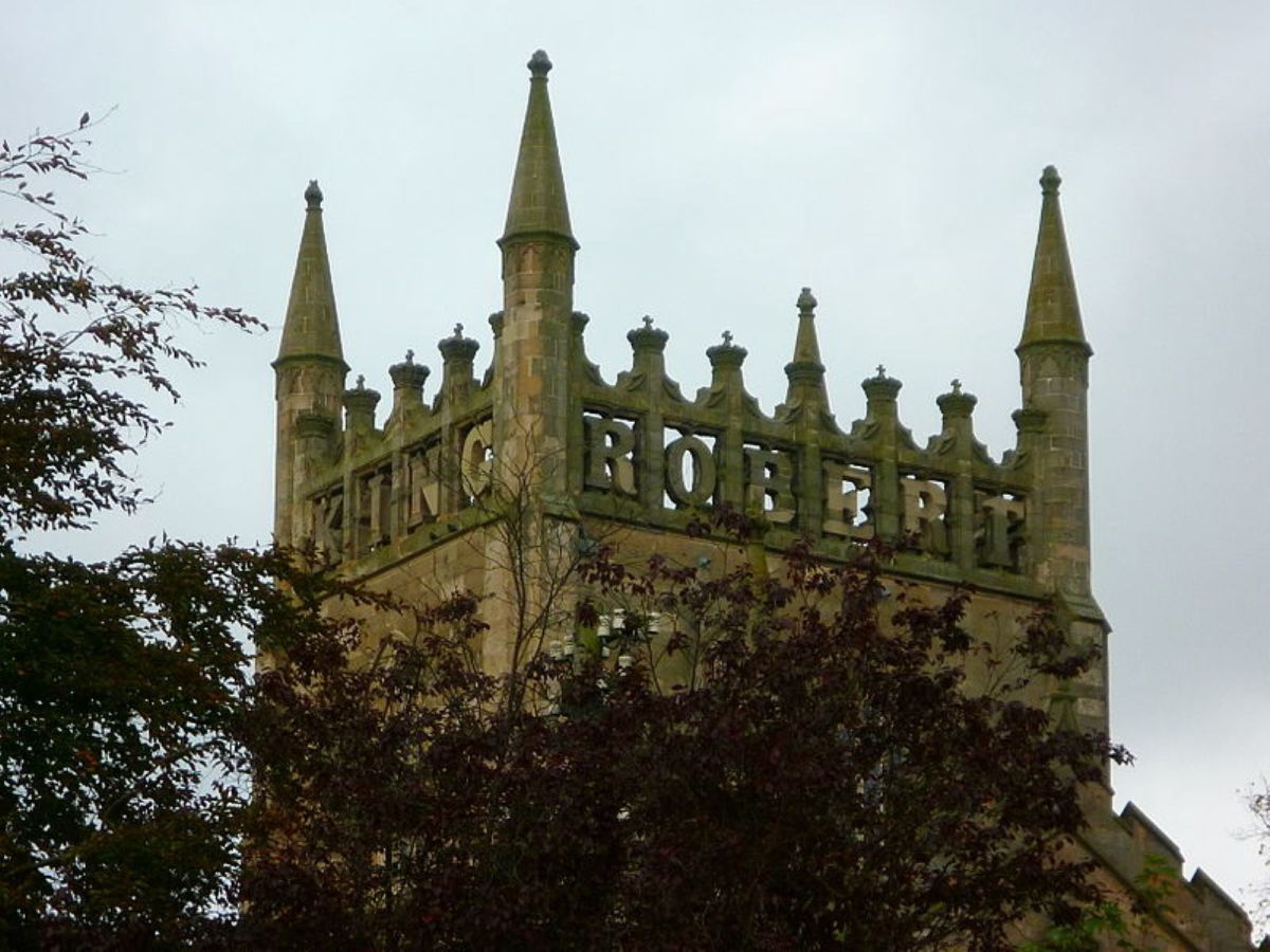 The tower of Dunfermline Abbey, Scotland. Robert the Bruce's burial place. "King" and "Robert" can be seen spelled out and "the" and "Bruce" are on the other sides. 