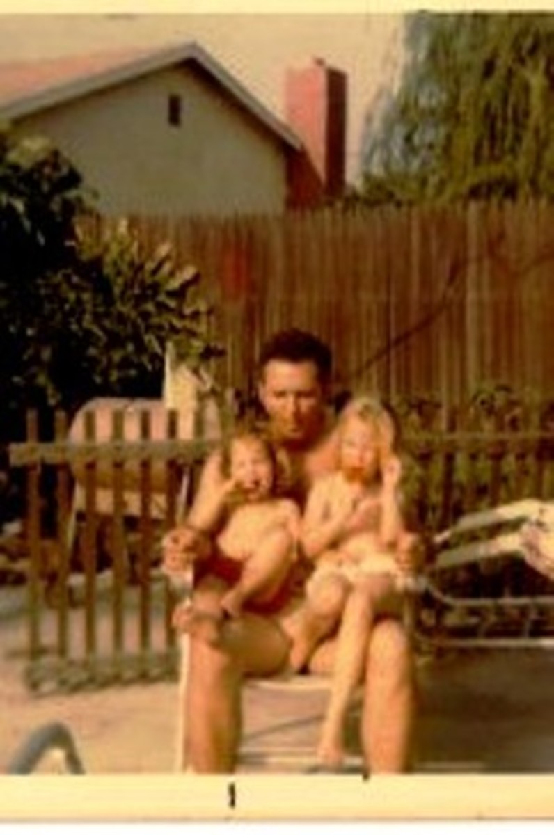 My sister and I sharing a Popsicle break with my father on a hot and sunny summer day in 1972 