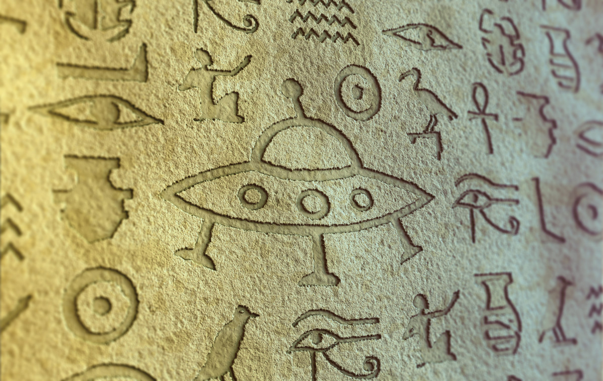 Flying saucer sign among egypt hieroglyphs.