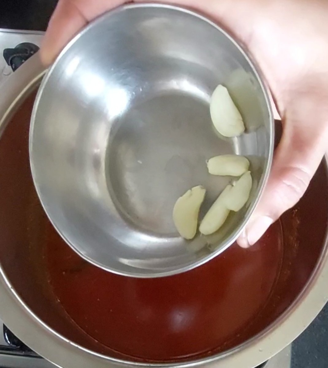 Add 4-5 crushed garlic cloves.