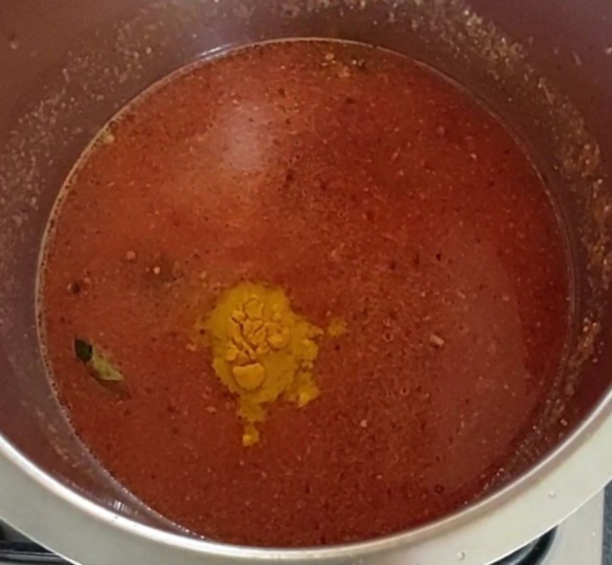 Add 1 cup of water and mix well. Add 1/2 teaspoon turmeric powder.