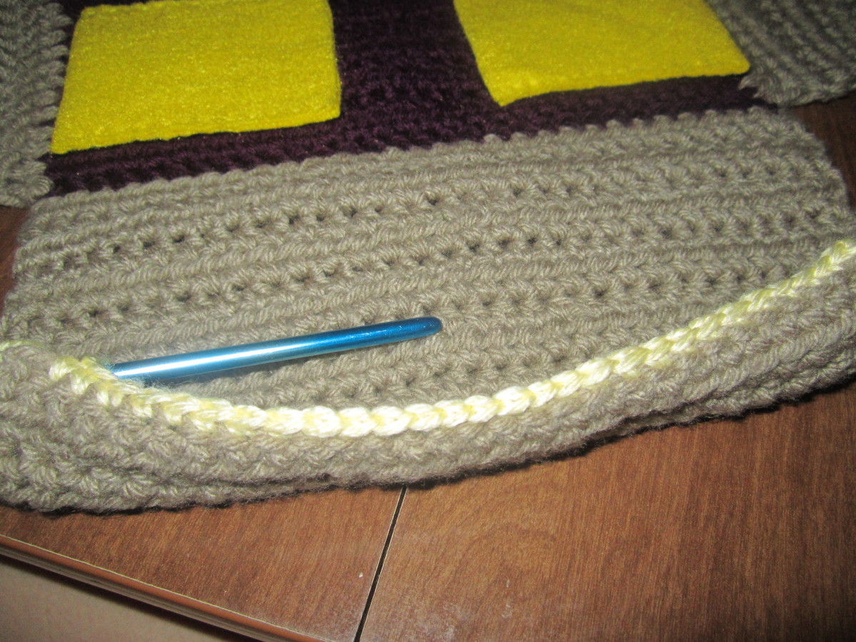 Crocheted pockets can be stitched on directly to panels.