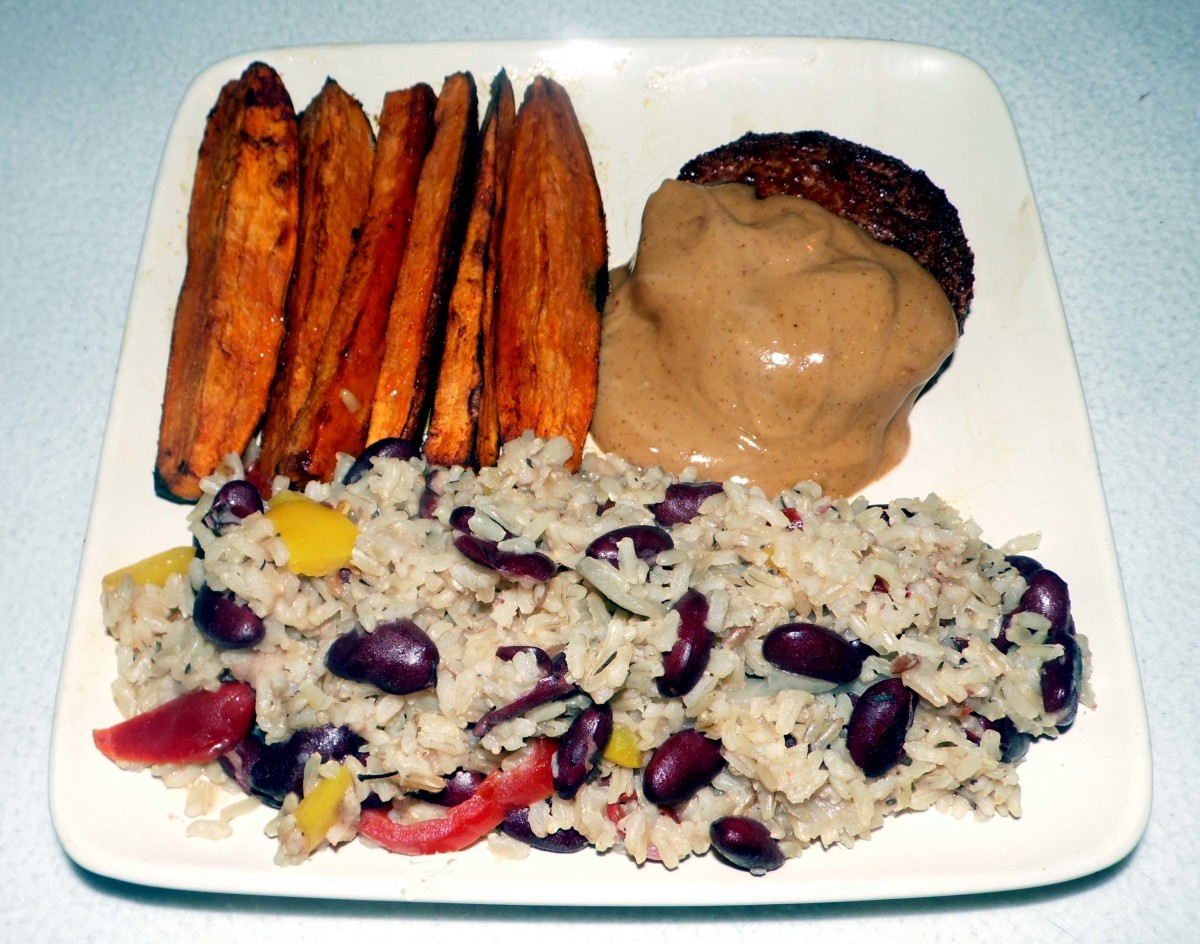 Rice and peas with vegan burger in peanut lime saue and sweet potato wedges