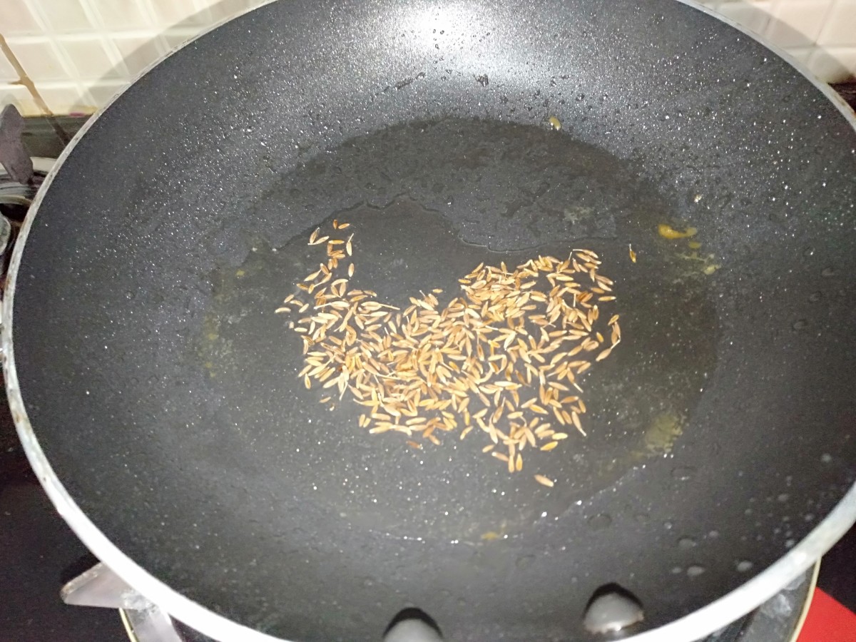 Heat oil in a pan and add cumin seeds. Sauté until brown.