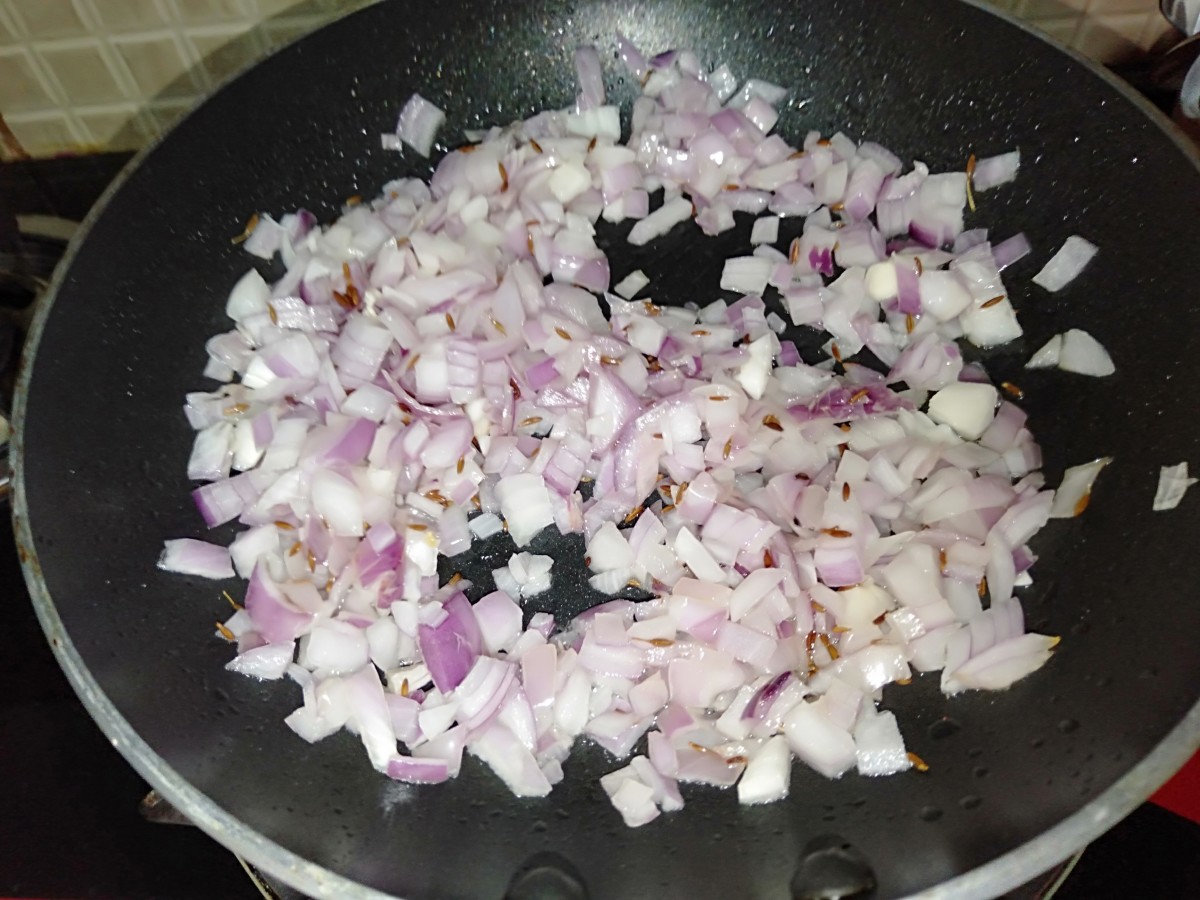 Add chopped onions and fry until they turn light brown.