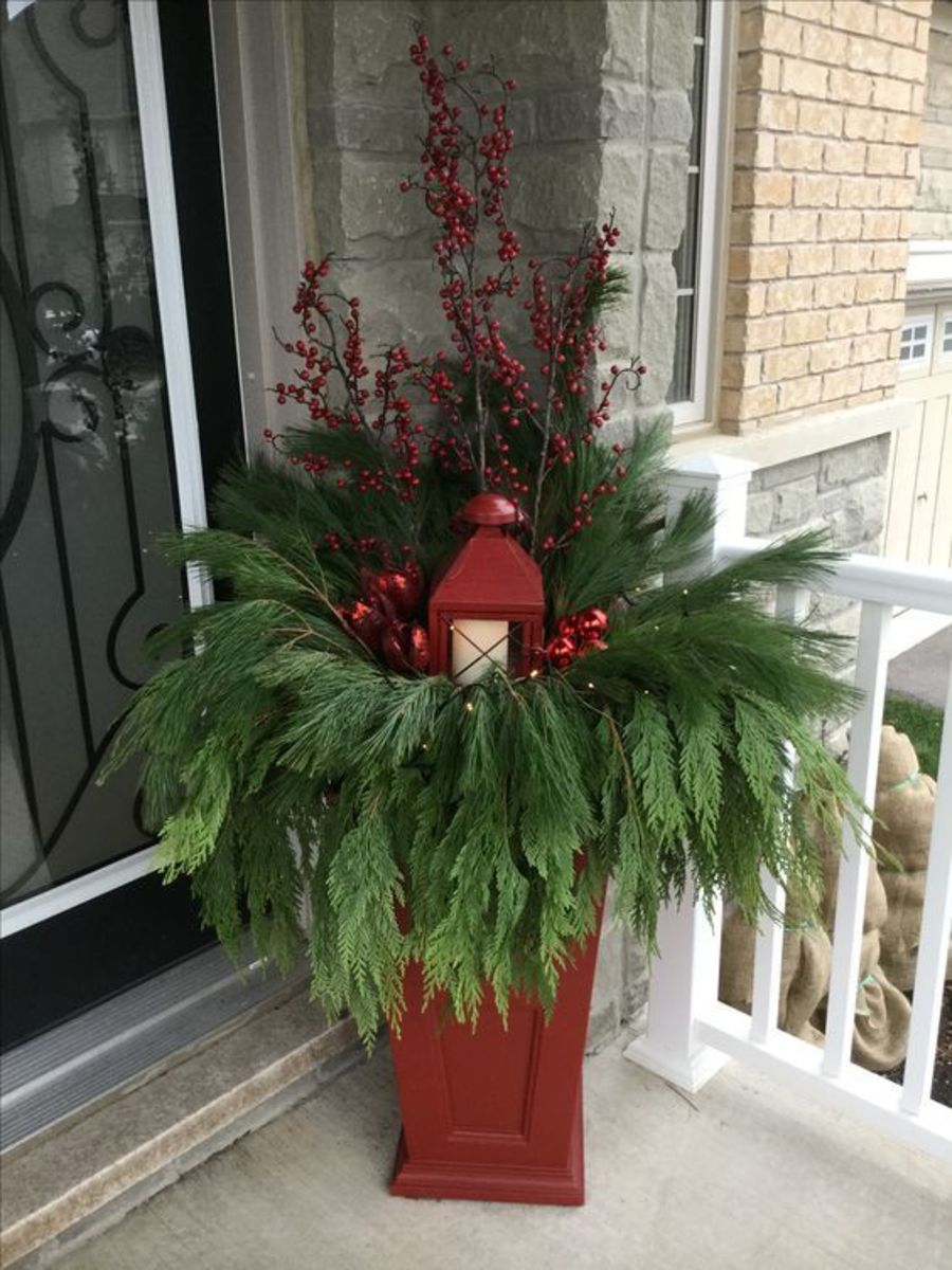 Red Planter Draped With Greenery