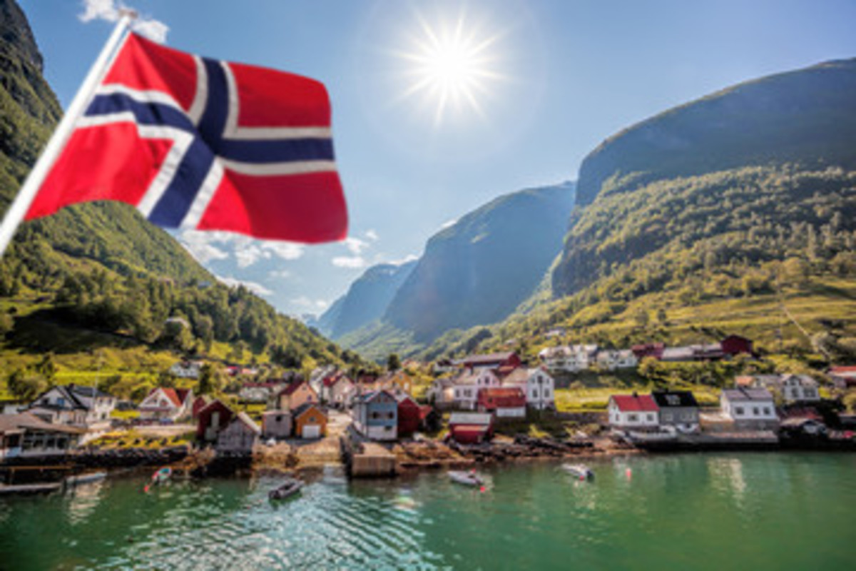 Beautiful Fishing village Undredal against mountain in Norway