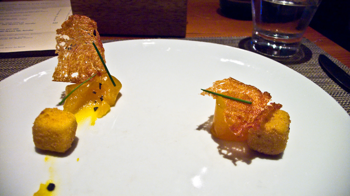 A molecular gastronomy rendition of eggs Benedict served by wd~50 in New York City. The cubes are deep-fried Hollandaise sauce.