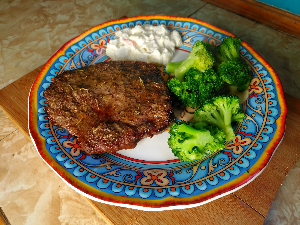 Steak with potato salad and broccoli