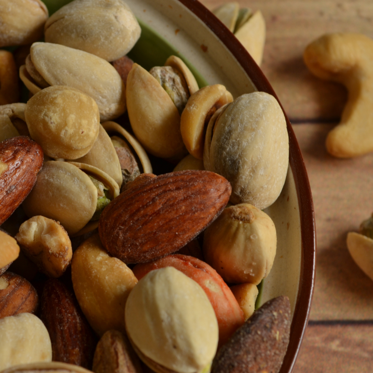 Dogs can eat certain types of nuts but should never be fed macadamia nuts.