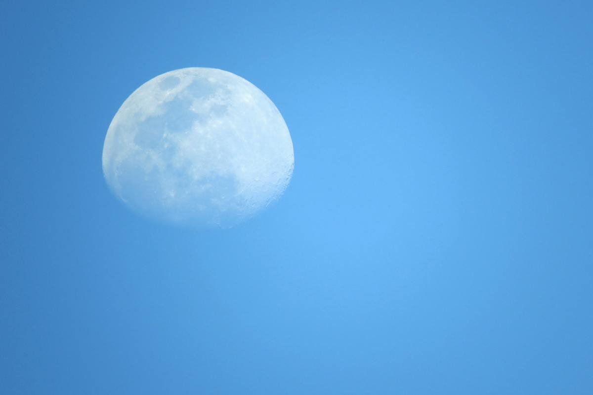 Why can we see the moon during the day?