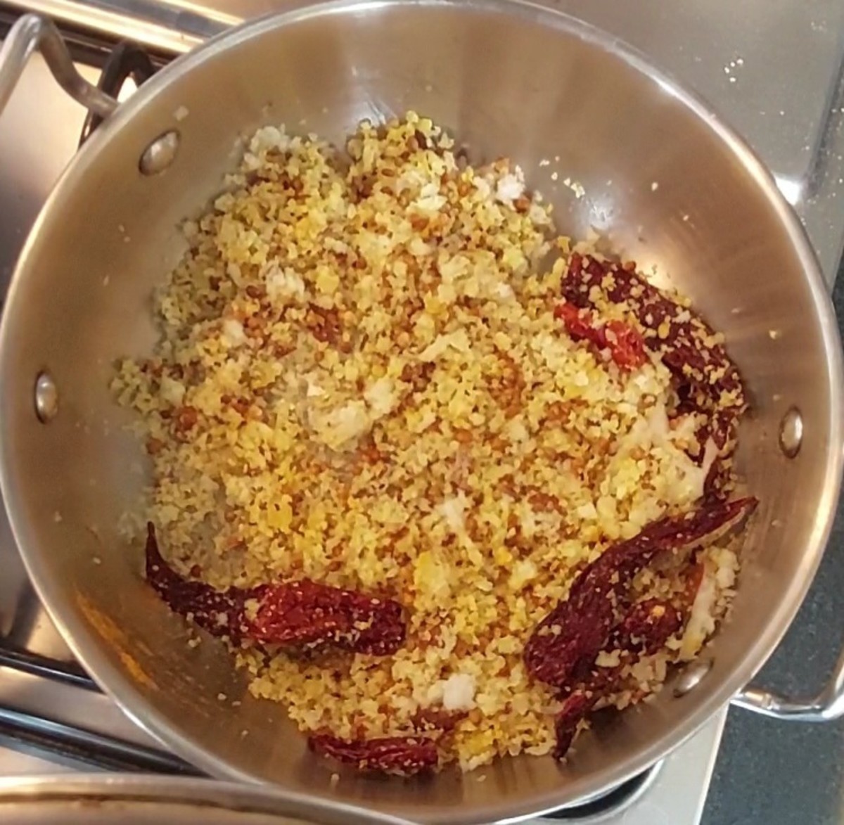 Add 1 cup grated coconut and 1/4 teaspoon turmeric powder. Mix well and switch off the flame. Let the mixture cool down.