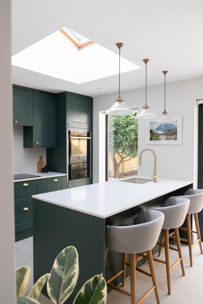 The Taurus kitchen will look lovely in an evergreen shade. Rounded chairs and rounded light fixtures go with Taurus' yin energy. When in doubt, add a houseplant. 